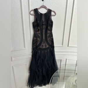 Black and neutral.  Only worn once evening gown. Light weight and elegant.